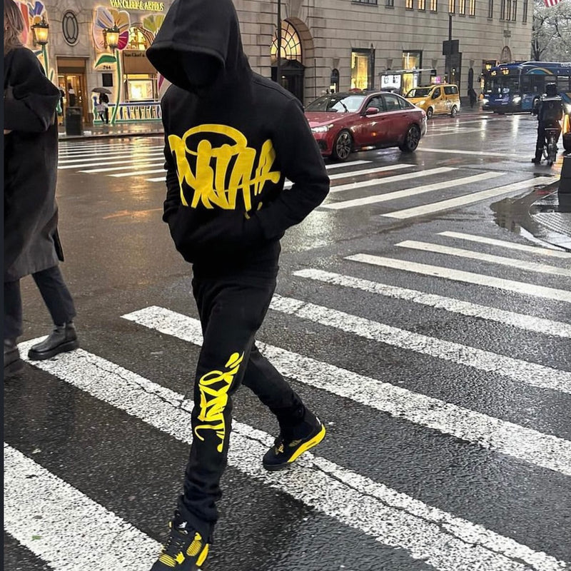 Syna World Team Tracksuit "Black/Safety Yellow"